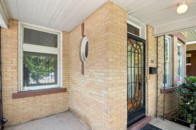 320 E 3rd Ave, Salt Lake City, UT 84103 - view of exterior entry featuring covered porch and brick siding