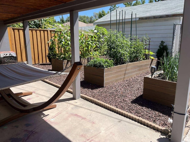 1133 E Sherman Ave S, Salt Lake City, UT 84105 - view of patio / terrace featuring a vegetable garden