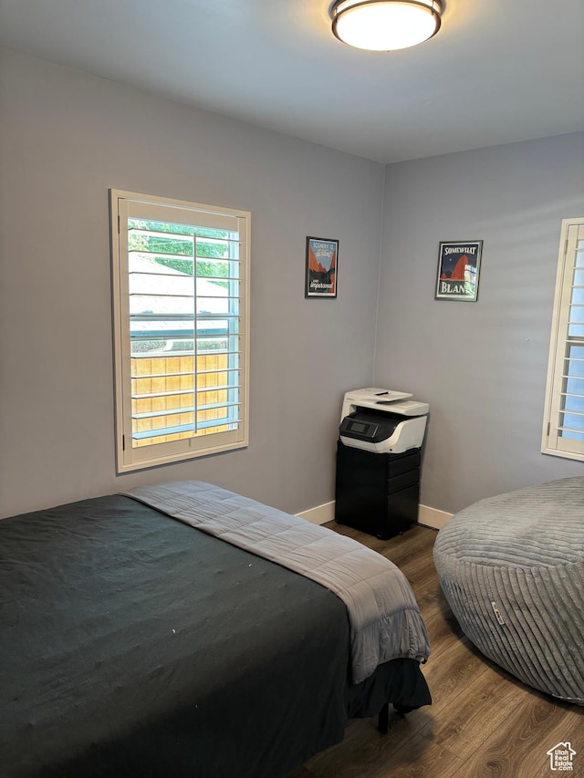 1133 E Sherman Ave S, Salt Lake City, UT 84105 - bedroom featuring wood finished floors and baseboards