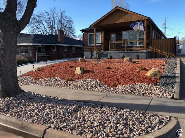 1133 E Sherman Ave S, Salt Lake City, UT 84105 - view of front of house with a porch and brick siding