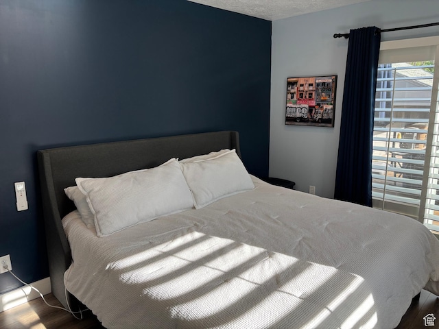 1133 E Sherman Ave S, Salt Lake City, UT 84105 - bedroom with wood finished floors and a textured ceiling