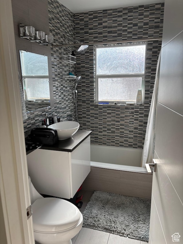 1133 E Sherman Ave S, Salt Lake City, UT 84105 - full bath with tiled shower / bath, vanity, tile patterned flooring, and tile walls