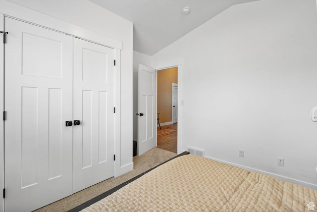 2418 E Quaking Aspen Ln, Eagle Mountain, UT 84005 - unfurnished bedroom featuring vaulted ceiling, carpet flooring, and a closet