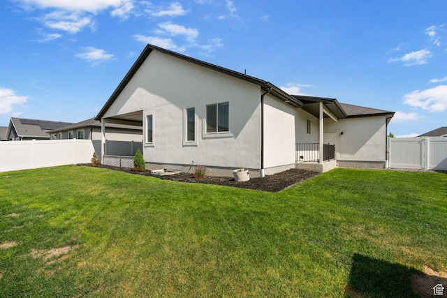 2418 E Quaking Aspen Ln, Eagle Mountain, UT 84005 - rear view of house with stucco siding