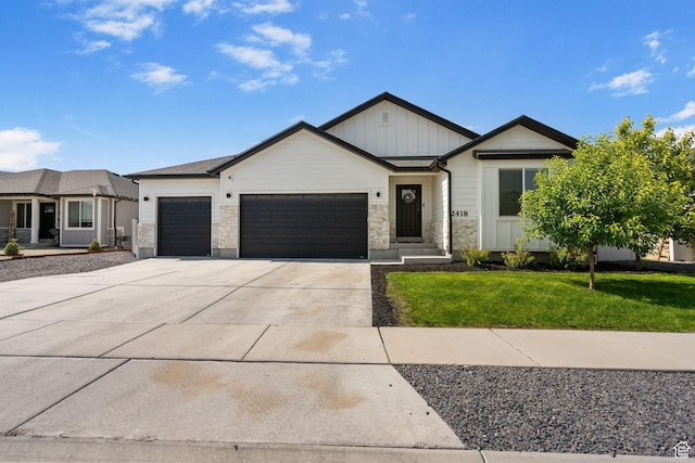 2418 E Quaking Aspen Ln, Eagle Mountain, UT 84005 - view of front facade with board and batten siding, an attached garage, driveway, a front yard, and stone siding