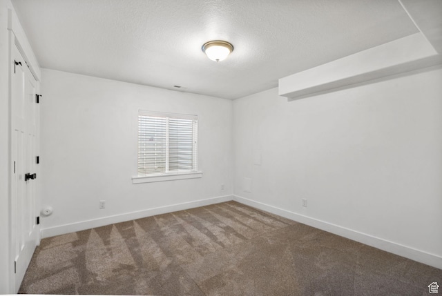 2418 E Quaking Aspen Ln, Eagle Mountain, UT 84005 - empty room featuring carpet flooring and a textured ceiling