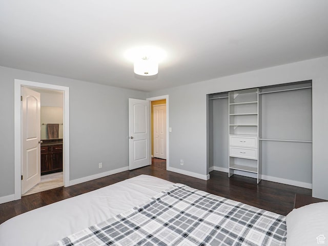 2333 W Ledgewood Dr, Taylorsville, UT 84129 - unfurnished bedroom with wood finished floors, a closet, and connected bathroom