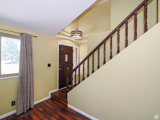 2333 W Ledgewood Dr, Taylorsville, UT 84129 - foyer entrance featuring wood finished floors, stairs, and a chandelier