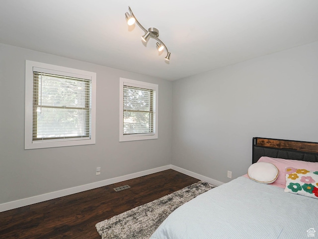 2333 W Ledgewood Dr, Taylorsville, UT 84129 - bedroom with dark wood-type flooring and baseboards