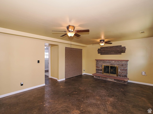2333 W Ledgewood Dr, Taylorsville, UT 84129 - unfurnished living room with a ceiling fan, finished concrete floors, and a stone fireplace