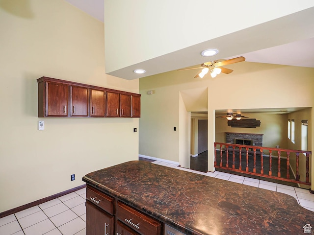 2333 W Ledgewood Dr, Taylorsville, UT 84129 - kitchen featuring a ceiling fan, light tile patterned floors, a fireplace, recessed lighting, and lofted ceiling