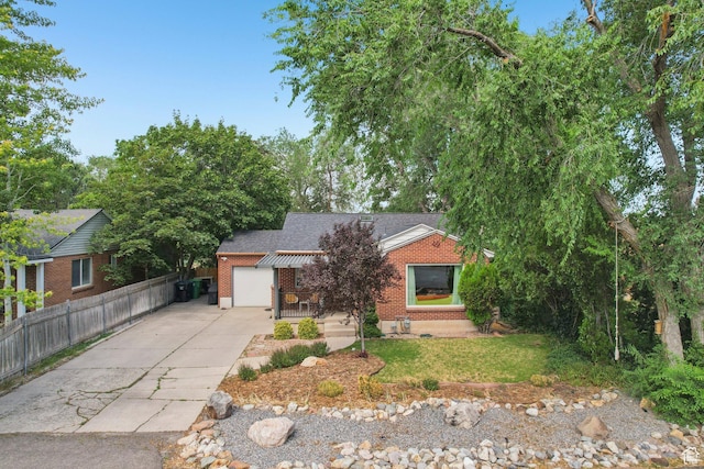 3232 S 2600 E, Salt Lake City, UT 84109 - obstructed view of property with concrete driveway, brick siding, a garage, and a shingled roof