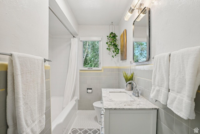 3232 S 2600 E, Salt Lake City, UT 84109 - full bathroom with vanity, shower / bath combo, tile walls, wainscoting, and tile patterned floors