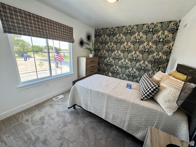 4230 W 1575th St S Unit 305, Ogden, UT 84401 - bedroom featuring carpet and a textured ceiling