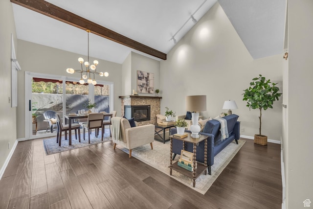 7430 S Wasatch Blvd E Unit I-2, Cottonwood Heights, UT 84121 - living area featuring dark wood-style flooring, a chandelier, a glass covered fireplace, beamed ceiling, and high vaulted ceiling