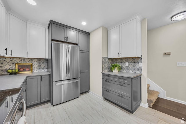 7430 S Wasatch Blvd E Unit I-2, Cottonwood Heights, UT 84121 - kitchen with stainless steel appliances, gray cabinets, tasteful backsplash, recessed lighting, and light countertops
