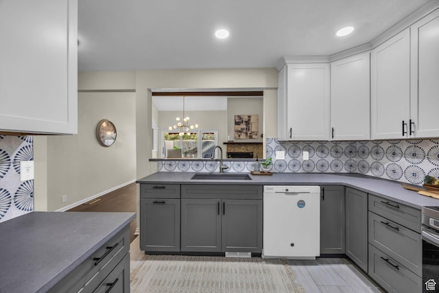 7430 S Wasatch Blvd E Unit I-2, Cottonwood Heights, UT 84121 - kitchen featuring white dishwasher, gray cabinets, tasteful backsplash, a chandelier, and white cabinets