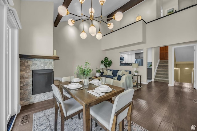7430 S Wasatch Blvd E Unit I-2, Cottonwood Heights, UT 84121 - dining area with a stone fireplace, stairway, wood finished floors, a chandelier, and a high ceiling