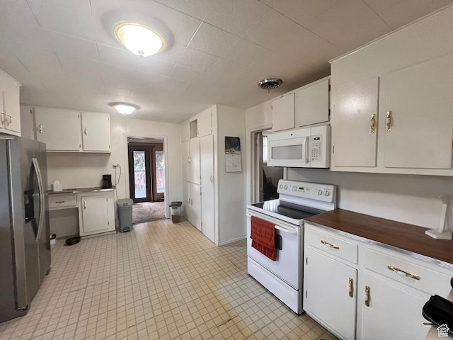 148 Duchesne St, Helper, UT 84526 - kitchen with white appliances, white cabinetry, and dark countertops