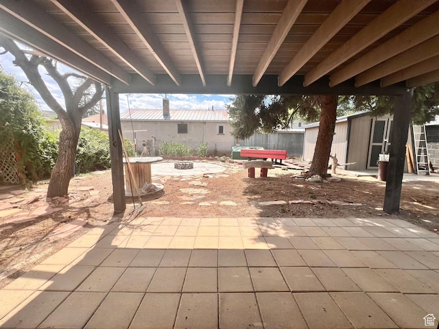 148 Duchesne St, Helper, UT 84526 - view of patio / terrace with a fire pit and a storage shed