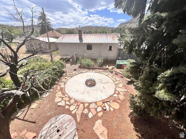 148 Duchesne St, Helper, UT 84526 - view of patio featuring an outdoor fire pit