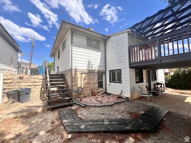 148 Duchesne St, Helper, UT 84526 - back of house featuring a patio, stairs, and a chimney