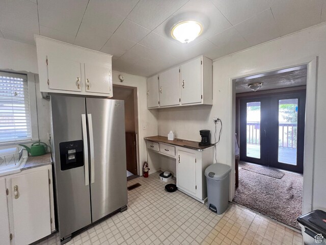 148 Duchesne St, Helper, UT 84526 - kitchen with stainless steel fridge with ice dispenser, white cabinets, and french doors