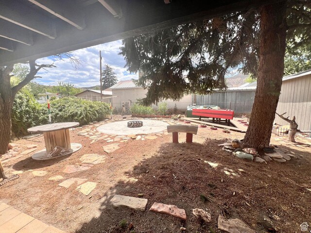 148 Duchesne St, Helper, UT 84526 - fenced backyard with a fire pit