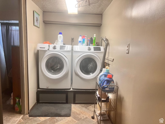 148 Duchesne St, Helper, UT 84526 - laundry room with washing machine and dryer, stone finish floors, and a textured ceiling