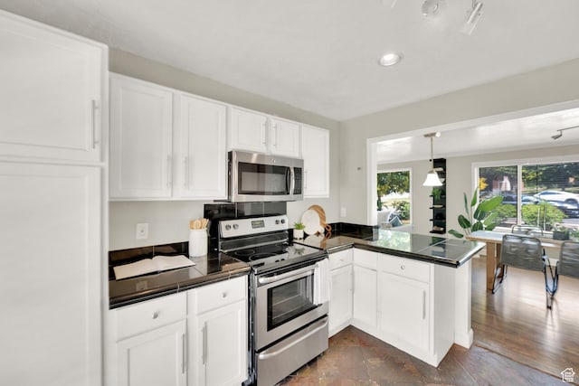 2270 E 1700 S, Salt Lake City, UT 84108 - kitchen featuring appliances with stainless steel finishes, a peninsula, white cabinets, pendant lighting, and recessed lighting