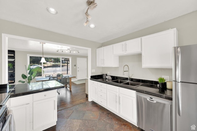 2270 E 1700 S, Salt Lake City, UT 84108 - kitchen with appliances with stainless steel finishes, white cabinets, rail lighting, and stone tile flooring