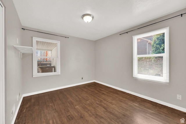 2270 E 1700 S, Salt Lake City, UT 84108 - unfurnished room featuring plenty of natural light and dark wood finished floors