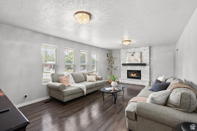 1456 Swan St, Ogden, UT 84401 - living room with wood finished floors, a textured ceiling, and a stone fireplace