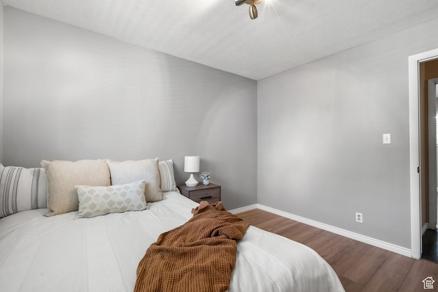 1456 Swan St, Ogden, UT 84401 - bedroom featuring baseboards and wood finished floors