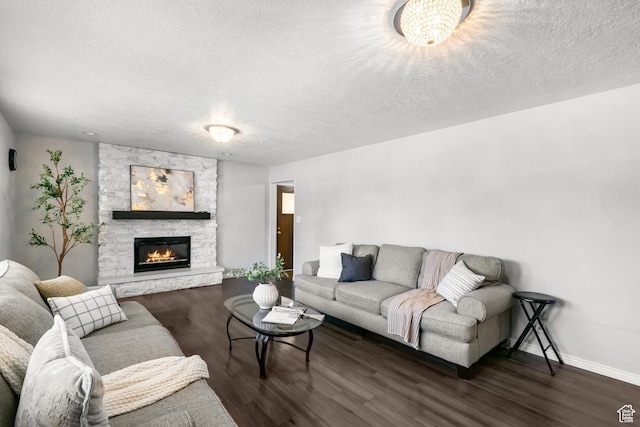 1456 Swan St, Ogden, UT 84401 - living area featuring wood finished floors, a textured ceiling, and a stone fireplace