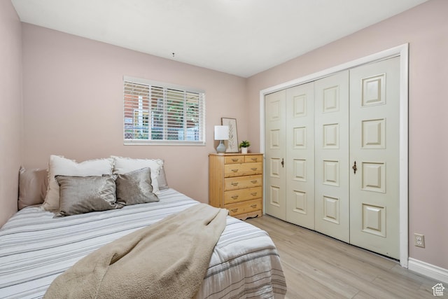 1456 Swan St, Ogden, UT 84401 - bedroom with light wood-style flooring and a closet