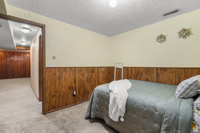 1456 Swan St, Ogden, UT 84401 - bedroom featuring wood walls, carpet floors, wainscoting, and a textured ceiling