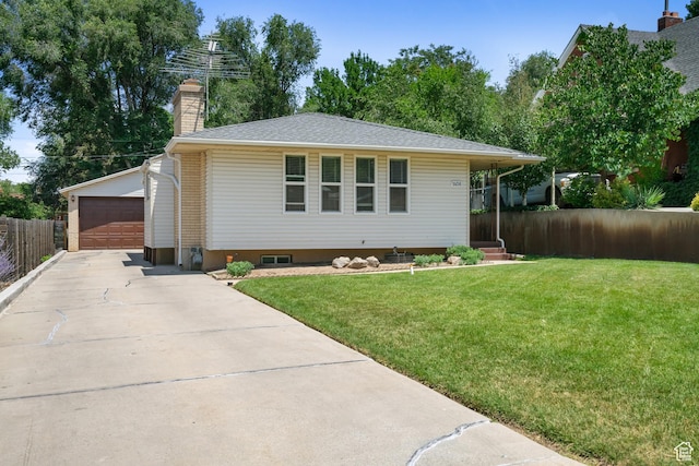 1456 Swan St, Ogden, UT 84401 - view of front of home featuring an outdoor structure, a garage, and a chimney
