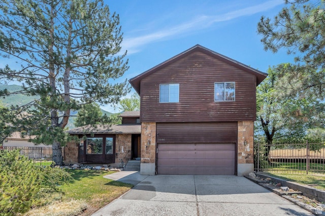 3286 Danish Hills Cir, Cottonwood Heights, UT 84121 - view of front facade featuring a garage, concrete driveway, and stone siding