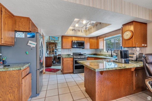 3286 Danish Hills Cir, Cottonwood Heights, UT 84121 - kitchen featuring stainless steel appliances, a peninsula, brown cabinetry, a raised ceiling, and light tile patterned floors