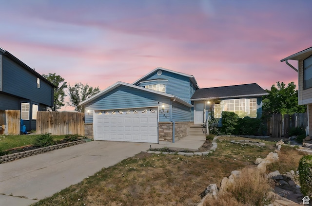 8770 S 3980 W, West Jordan, UT 84084 - view of front facade featuring concrete driveway, a garage, brick siding, and entry steps