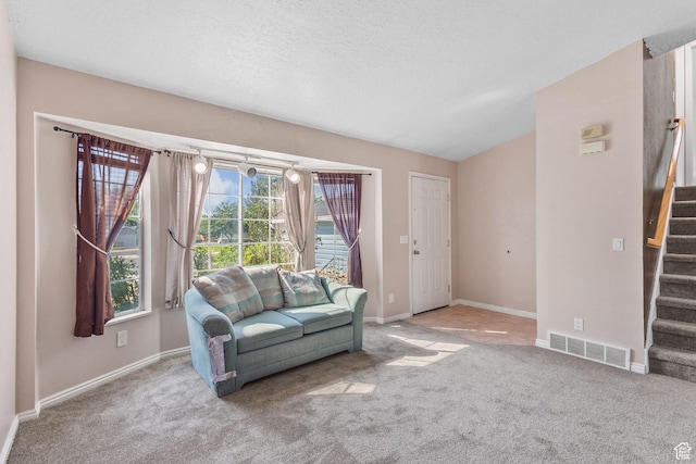8770 S 3980 W, West Jordan, UT 84084 - carpeted living area with stairway and a textured ceiling