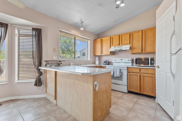 8770 S 3980 W, West Jordan, UT 84084 - kitchen featuring white range with electric cooktop, stainless steel microwave, under cabinet range hood, a peninsula, and light tile patterned flooring