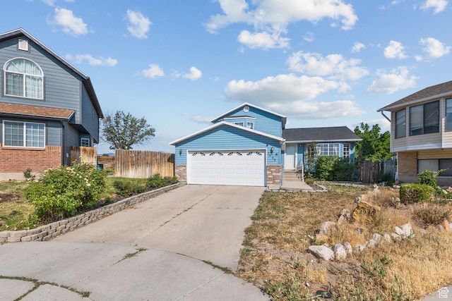 8770 S 3980 W, West Jordan, UT 84084 - traditional home featuring driveway, brick siding, and an attached garage