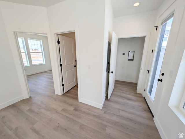 11369 S Watercourse Rd W Unit 202, South Jordan, UT 84009 - corridor with light wood-style floors and recessed lighting
