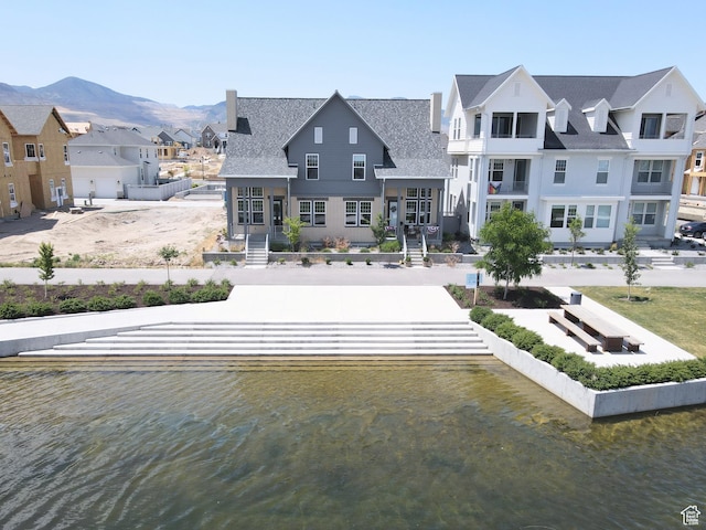 11369 S Watercourse Rd W Unit 202, South Jordan, UT 84009 - rear view of property featuring a residential view and a water and mountain view