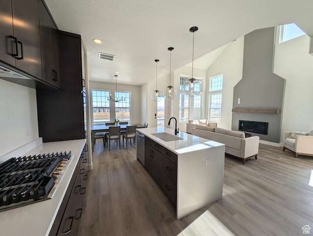 11369 S Watercourse Rd W Unit 202, South Jordan, UT 84009 - kitchen with stainless steel appliances, wood finished floors, a chandelier, healthy amount of natural light, and recessed lighting