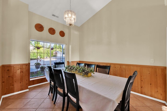2313 N 850 E, Lehi, UT 84043 - dining space with wainscoting, high vaulted ceiling, a chandelier, wooden walls, and tile patterned flooring
