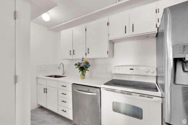 2313 N 850 E, Lehi, UT 84043 - kitchen with appliances with stainless steel finishes, decorative backsplash, white cabinetry, light marble finish flooring, and light countertops