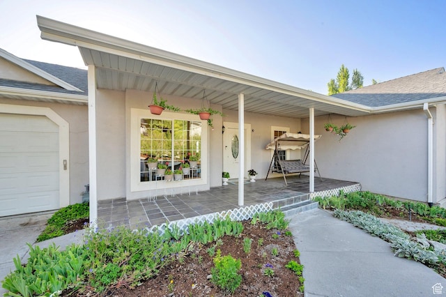 2313 N 850 E, Lehi, UT 84043 - property entrance with covered porch, stucco siding, a shingled roof, and a garage